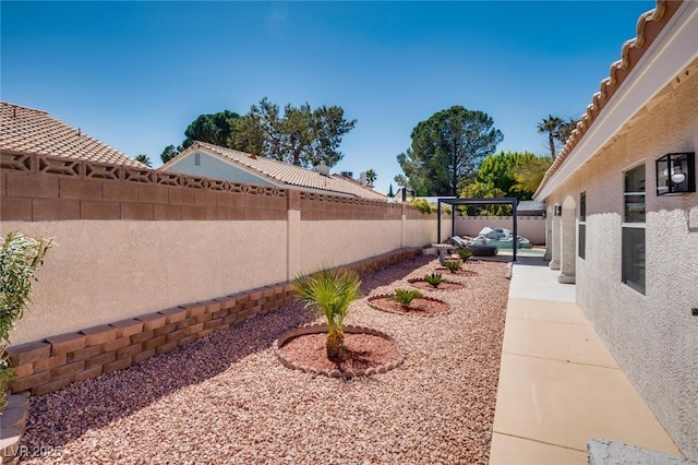 825 Royal Moon Ave, Las Vegas, NV 89123 - fenced backyard with a patio