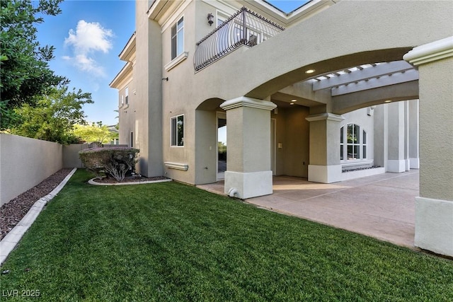 9408 Players Canyon Ct, Las Vegas, NV 89144 - rear view of house with a balcony, stucco siding, and a patio