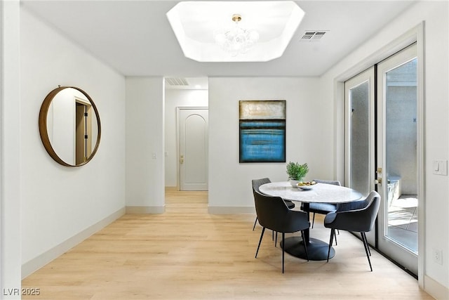 9408 Players Canyon Ct, Las Vegas, NV 89144 - dining space featuring light wood-style flooring and a chandelier