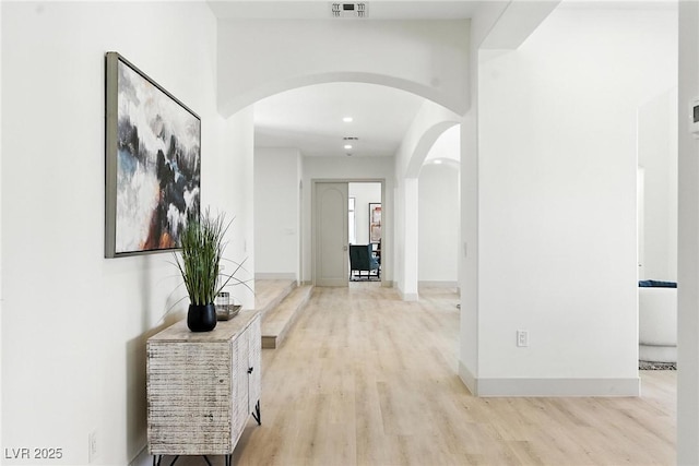 9408 Players Canyon Ct, Las Vegas, NV 89144 - hall with arched walkways and light wood-style flooring