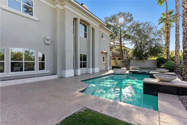 9408 Players Canyon Ct, Las Vegas, NV 89144 - view of pool featuring a patio area, a fenced backyard, and a pool with connected hot tub