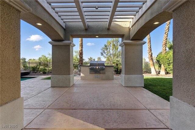 9408 Players Canyon Ct, Las Vegas, NV 89144 - view of patio / terrace featuring an outdoor kitchen and a pergola