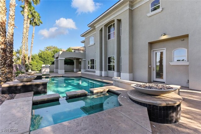 9408 Players Canyon Ct, Las Vegas, NV 89144 - view of swimming pool featuring a patio area and a pool with connected hot tub