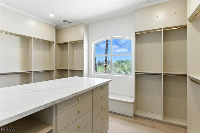 9408 Players Canyon Ct, Las Vegas, NV 89144 - walk in closet with light wood finished floors