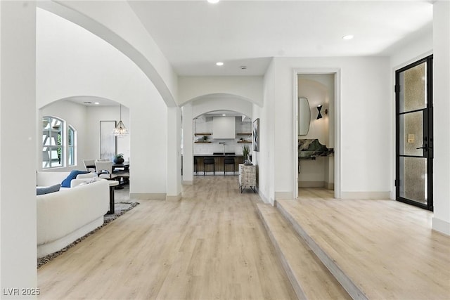 9408 Players Canyon Ct, Las Vegas, NV 89144 - hall with arched walkways, light wood-style floors, and recessed lighting