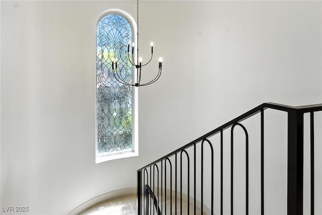 9408 Players Canyon Ct, Las Vegas, NV 89144 - stairway with a chandelier and plenty of natural light