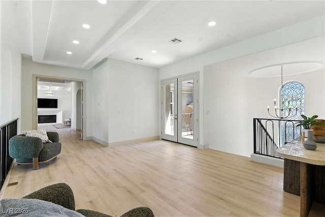 9408 Players Canyon Ct, Las Vegas, NV 89144 - living room featuring light wood-style floors, a chandelier, a fireplace, and recessed lighting