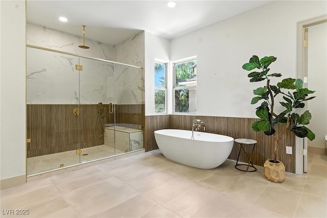 9408 Players Canyon Ct, Las Vegas, NV 89144 - full bath with a marble finish shower, a wainscoted wall, a soaking tub, recessed lighting, and wooden walls