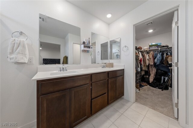 2732 Roman Palm Rd, North Las Vegas, NV 89086 - bathroom with double vanity, tile patterned flooring, and a spacious closet