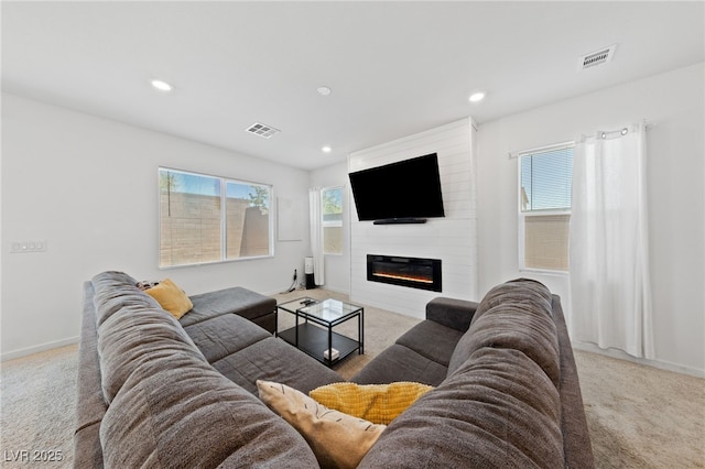 2732 Roman Palm Rd, North Las Vegas, NV 89086 - carpeted living area featuring recessed lighting and a large fireplace