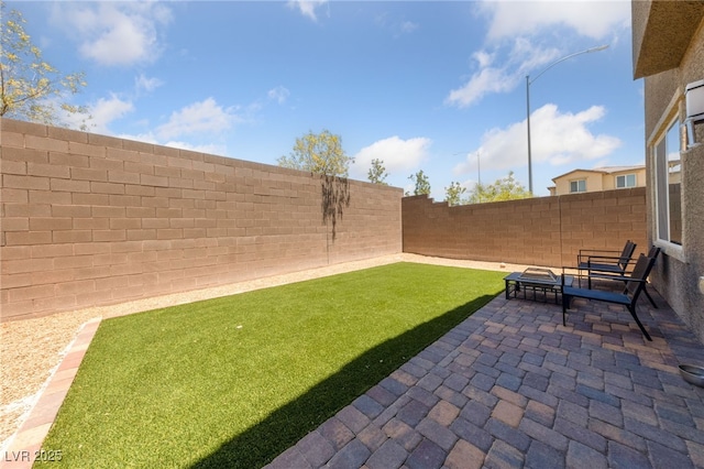 2732 Roman Palm Rd, North Las Vegas, NV 89086 - fenced backyard with a patio and an outdoor fire pit
