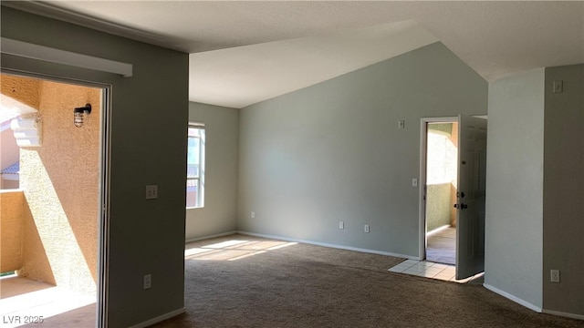 8101 W Flamingo Rd Unit 2110, Las Vegas, NV 89147 - spare room with carpet and vaulted ceiling