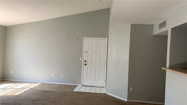 8101 W Flamingo Rd Unit 2110, Las Vegas, NV 89147 - spare room featuring light colored carpet and lofted ceiling