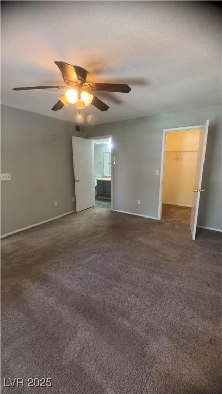 8101 W Flamingo Rd Unit 2110, Las Vegas, NV 89147 - unfurnished bedroom featuring carpet, ceiling fan, and ensuite bath