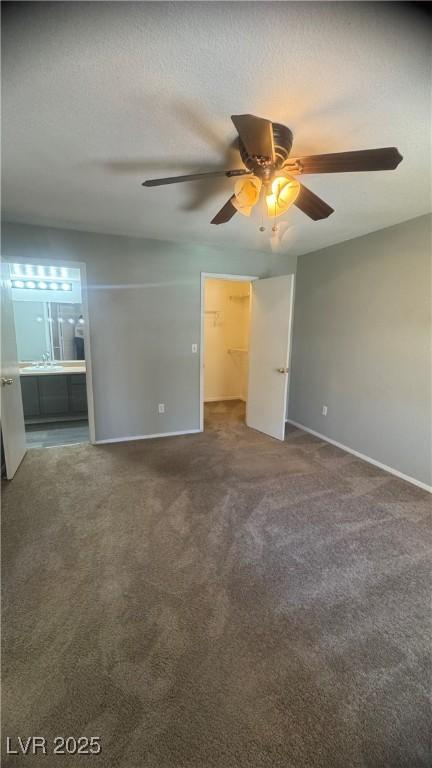 8101 W Flamingo Rd Unit 2110, Las Vegas, NV 89147 - carpeted empty room with baseboards and ceiling fan