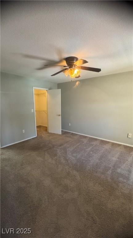 8101 W Flamingo Rd Unit 2110, Las Vegas, NV 89147 - unfurnished room with ceiling fan, carpet, and a textured ceiling