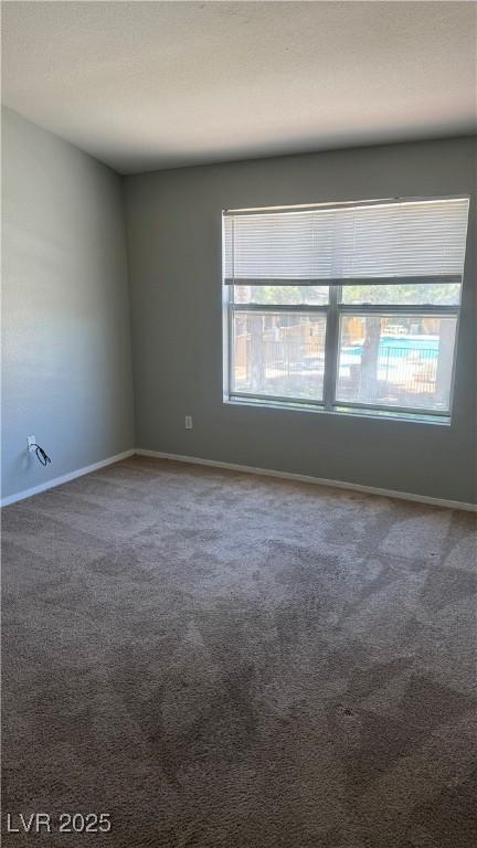 8101 W Flamingo Rd Unit 2110, Las Vegas, NV 89147 - empty room featuring healthy amount of natural light and carpet flooring