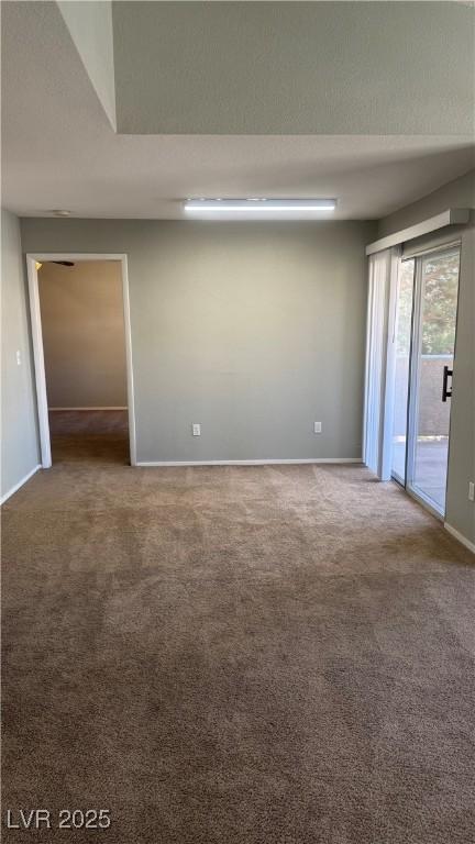 8101 W Flamingo Rd Unit 2110, Las Vegas, NV 89147 - empty room featuring carpet flooring and baseboards