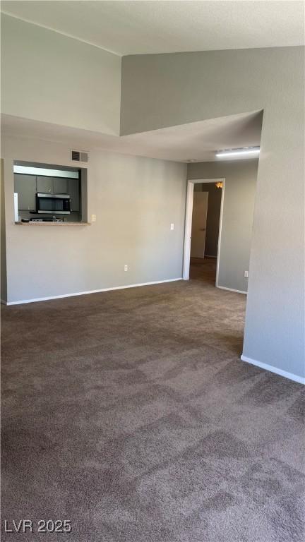 8101 W Flamingo Rd Unit 2110, Las Vegas, NV 89147 - spare room featuring carpet floors and lofted ceiling