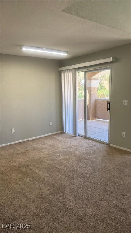 8101 W Flamingo Rd Unit 2110, Las Vegas, NV 89147 - carpeted empty room featuring baseboards