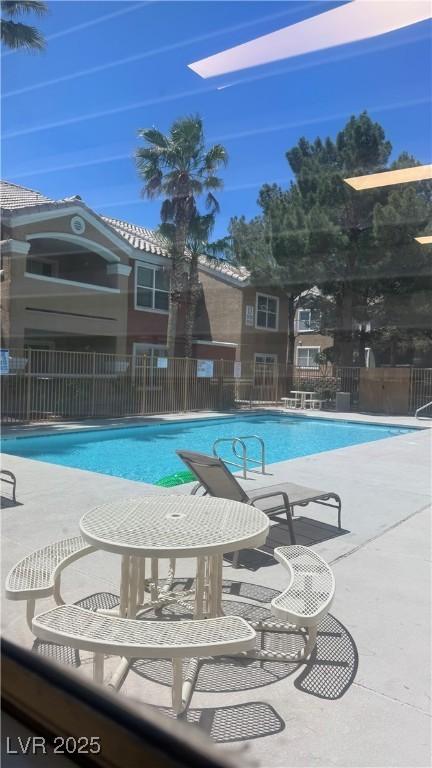 8101 W Flamingo Rd Unit 2110, Las Vegas, NV 89147 - community pool featuring a patio