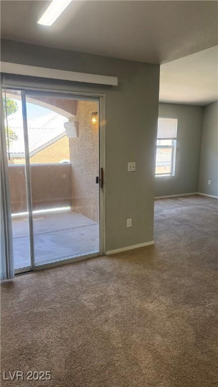 8101 W Flamingo Rd Unit 2110, Las Vegas, NV 89147 - spare room featuring carpet flooring and baseboards