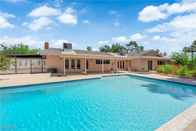 3753 Meadowcrest Dr, Las Vegas, NV 89121 - view of swimming pool with french doors and a patio