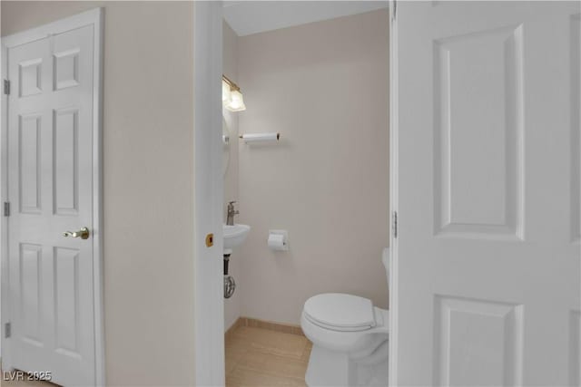 3753 Meadowcrest Dr, Las Vegas, NV 89121 - half bath featuring toilet and tile patterned flooring