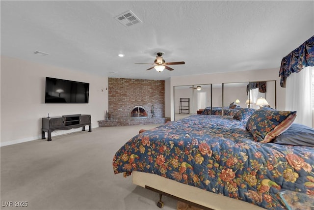 3753 Meadowcrest Dr, Las Vegas, NV 89121 - bedroom featuring carpet floors, ceiling fan, a textured ceiling, and a brick fireplace