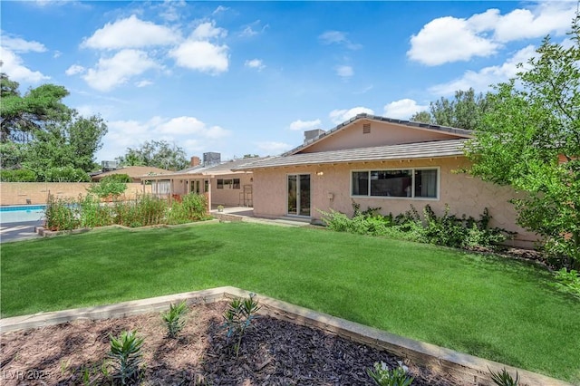 3753 Meadowcrest Dr, Las Vegas, NV 89121 - rear view of house featuring stucco siding and a patio