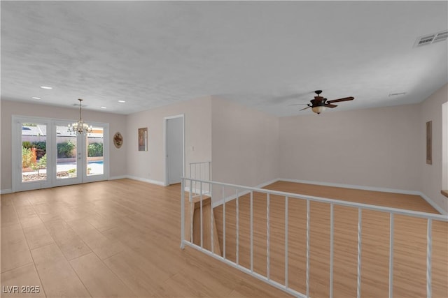 3753 Meadowcrest Dr, Las Vegas, NV 89121 - unfurnished room featuring a chandelier, a ceiling fan, light wood-style floors, and recessed lighting