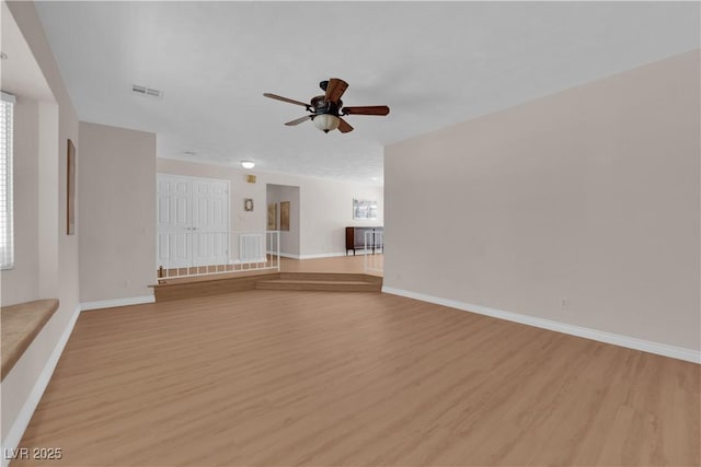 3753 Meadowcrest Dr, Las Vegas, NV 89121 - unfurnished living room featuring light wood-type flooring and a ceiling fan