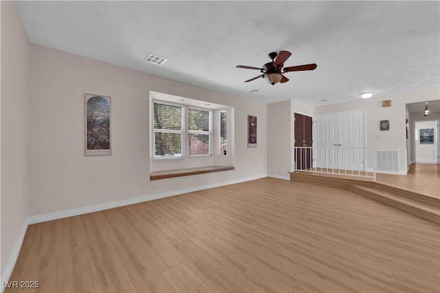 3753 Meadowcrest Dr, Las Vegas, NV 89121 - unfurnished living room with light wood-type flooring and a ceiling fan