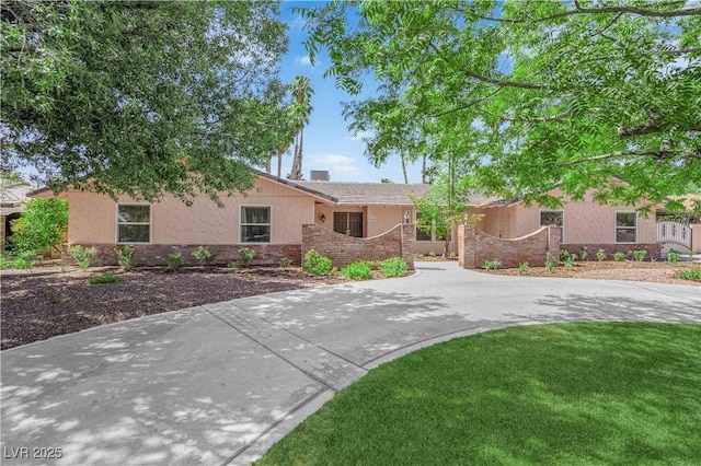 3753 Meadowcrest Dr, Las Vegas, NV 89121 - single story home with brick siding, stucco siding, and a front yard