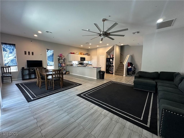 6450 Cinnamon Hazlenut St, North Las Vegas, NV 89084 - living area with a ceiling fan, stairs, recessed lighting, and wood finish floors