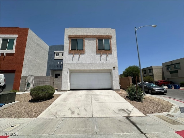 6450 Cinnamon Hazlenut St, North Las Vegas, NV 89084 - view of front of home featuring an attached garage, concrete driveway, and stucco siding