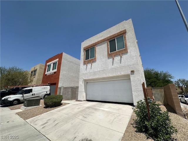 6450 Cinnamon Hazlenut St, North Las Vegas, NV 89084 - view of front of property with a garage, concrete driveway, and stucco siding