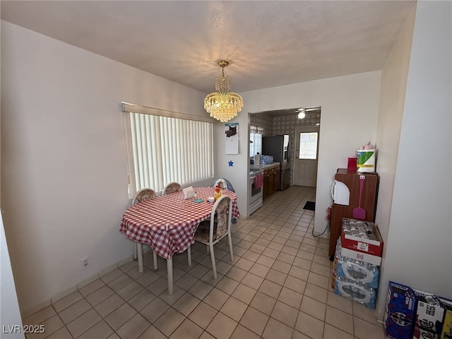 4567 S Nellis Blvd, Las Vegas, NV 89121 - dining room with a chandelier and light tile patterned floors