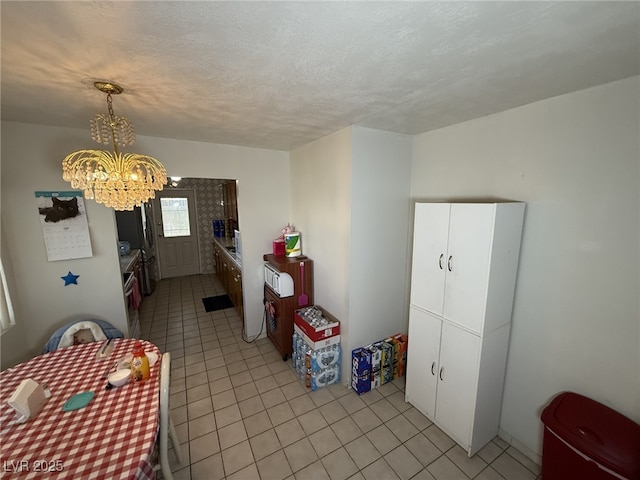 4567 S Nellis Blvd, Las Vegas, NV 89121 - dining room featuring light tile patterned floors and a chandelier