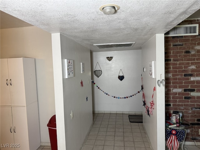 4567 S Nellis Blvd, Las Vegas, NV 89121 - hall featuring a textured ceiling and light tile patterned floors