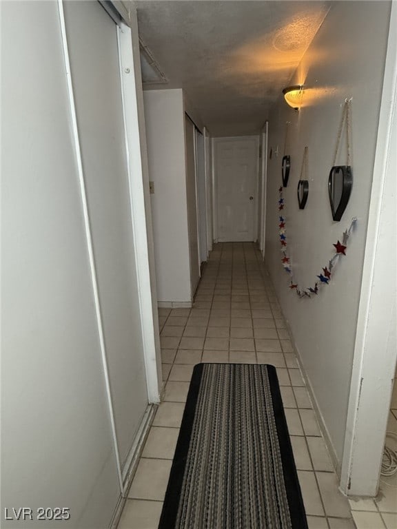 4567 S Nellis Blvd, Las Vegas, NV 89121 - corridor with light tile patterned floors