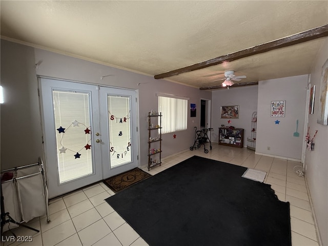 4567 S Nellis Blvd, Las Vegas, NV 89121 - entryway with light tile patterned floors, french doors, a ceiling fan, a textured ceiling, and ornamental molding