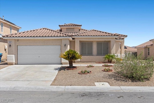 820 Peach Ave, North Las Vegas, NV 89032 - mediterranean / spanish-style house with a tile roof, driveway, a garage, and stucco siding