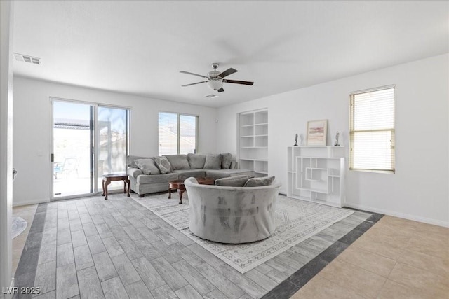 820 Peach Ave, North Las Vegas, NV 89032 - living area featuring ceiling fan and built in shelves