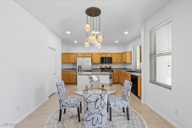 820 Peach Ave, North Las Vegas, NV 89032 - dining space with a chandelier, light tile patterned floors, and recessed lighting