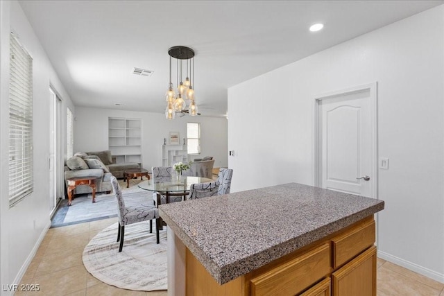 820 Peach Ave, North Las Vegas, NV 89032 - dining space featuring built in shelves, light tile patterned flooring, a chandelier, and recessed lighting