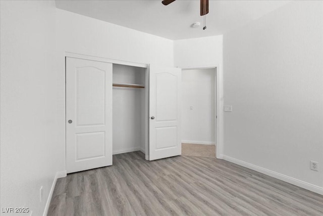 820 Peach Ave, North Las Vegas, NV 89032 - unfurnished bedroom with light wood-style floors, a closet, and ceiling fan