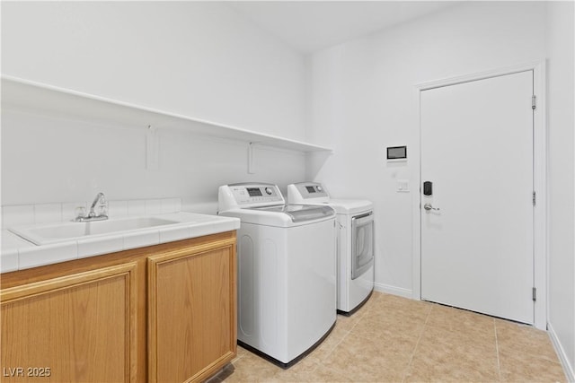 820 Peach Ave, North Las Vegas, NV 89032 - washroom with independent washer and dryer, cabinet space, and light tile patterned flooring