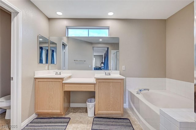 967 Coronado Peak Ave, Las Vegas, NV 89183 - bathroom with double vanity, a garden tub, and tile patterned floors
