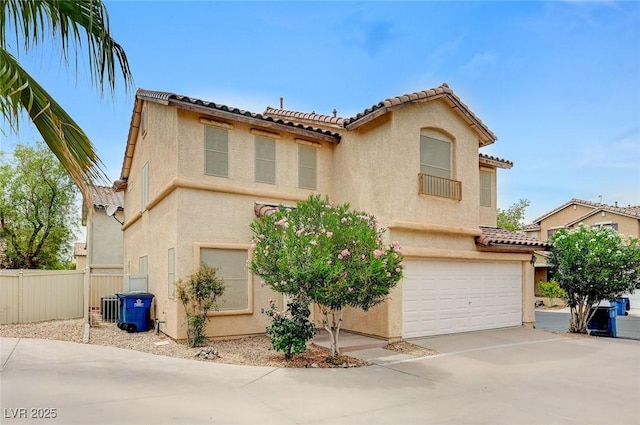 967 Coronado Peak Ave, Las Vegas, NV 89183 - mediterranean / spanish home featuring a tile roof, a garage, and stucco siding
